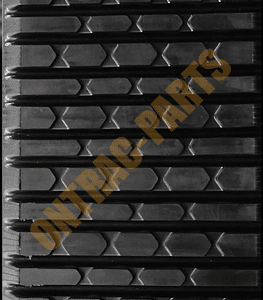 Close view of the tread of the Cat 277b rubber track.