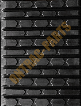 Close view of the tread of the Cat 277b rubber track.